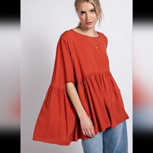 easel burnt orange blouse